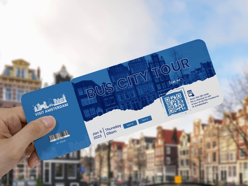 hand holding a blue ticket with a qr code across a skyline