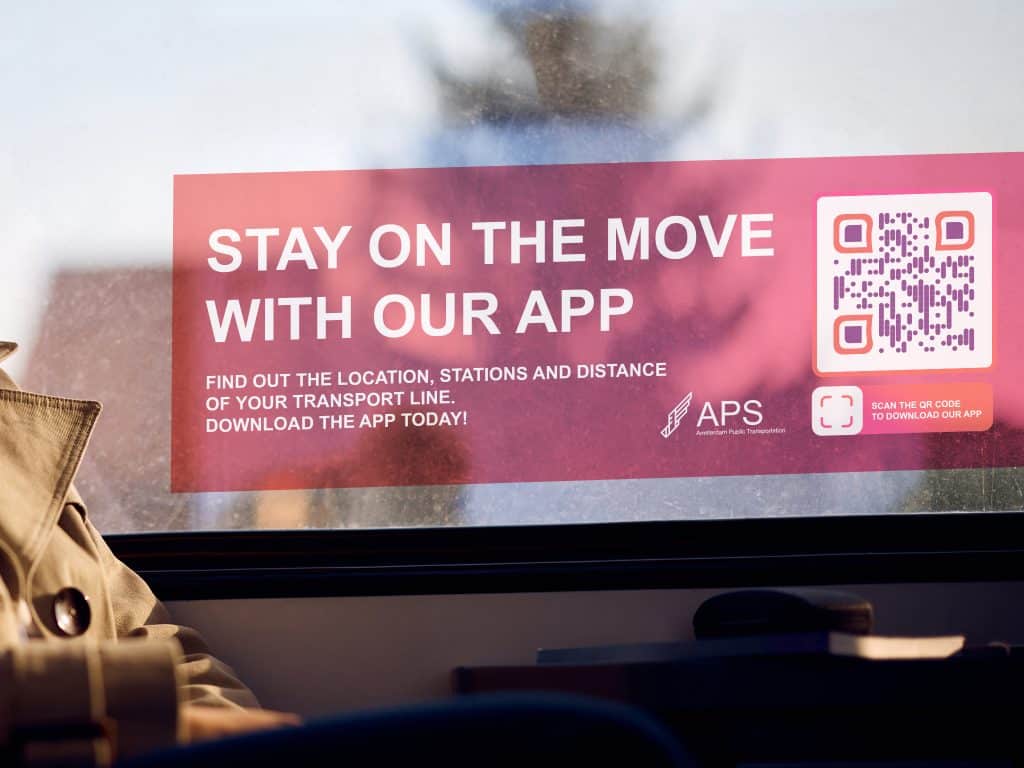 a qr code on a window with a red sign saying to download their app