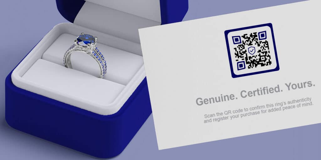 a qr code for Anti-counterfeit Authentication for High-Value Goods on a business card with a ring box behind it with a blue gem
