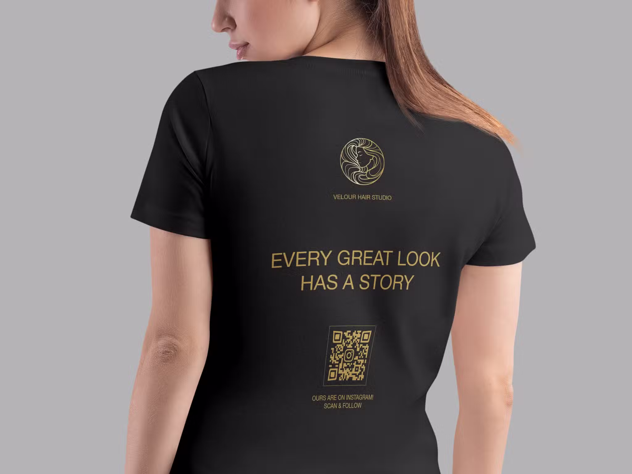 instagram qr code for a salon on the back of a black t-shirt that a lady is wearing